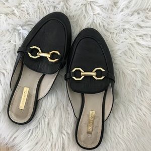 Black and gold leather loafers
